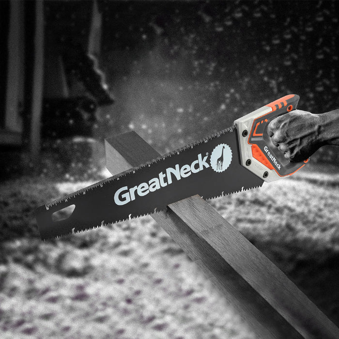 Black and white image of someone using a GreatNeck Tools saw where only the saw is colored orange.